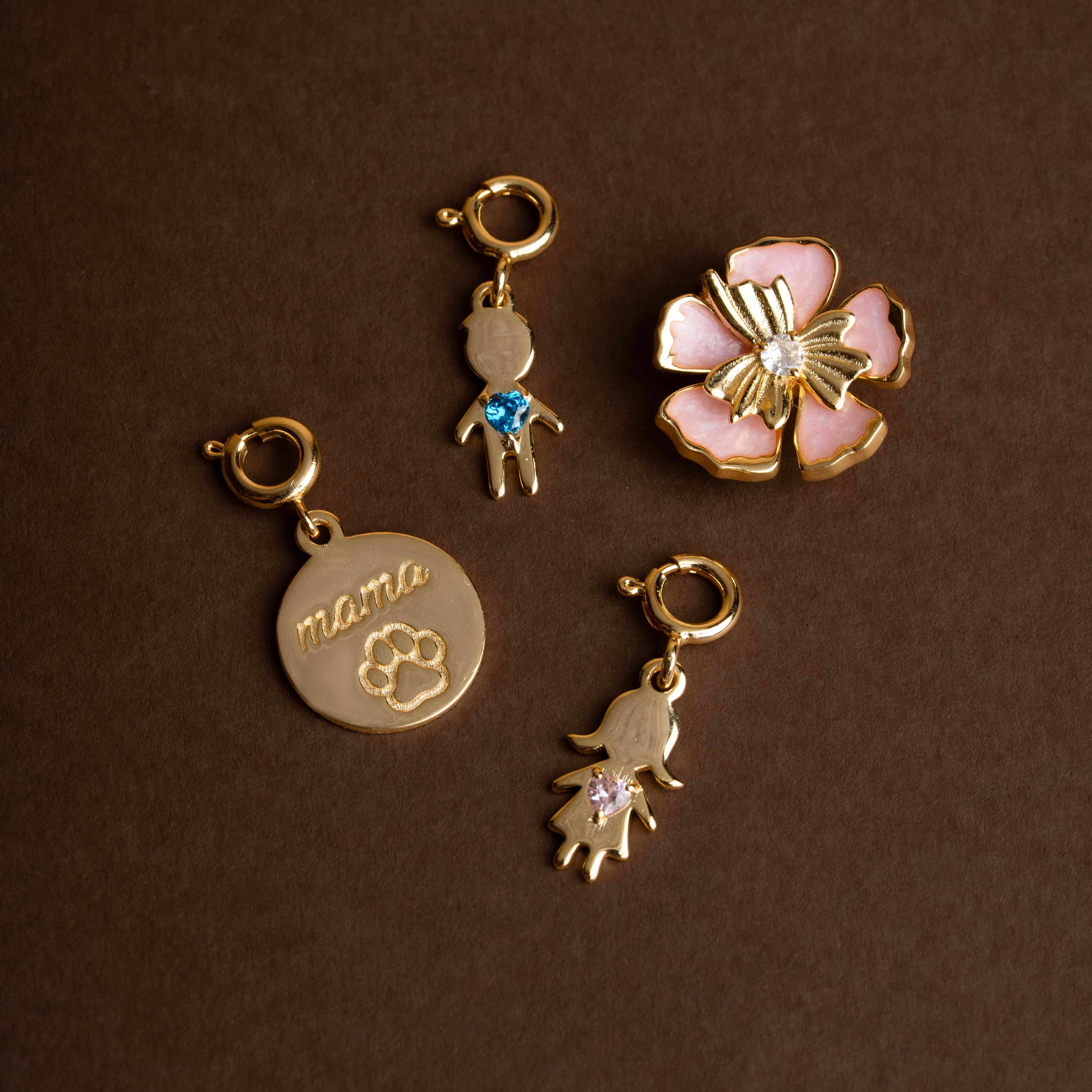 Set of gold charms on a brown background